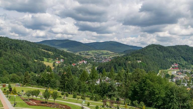 View at the nearby mountains from the magic garden tower in Muszyna shutterstock_1044878971.jpg