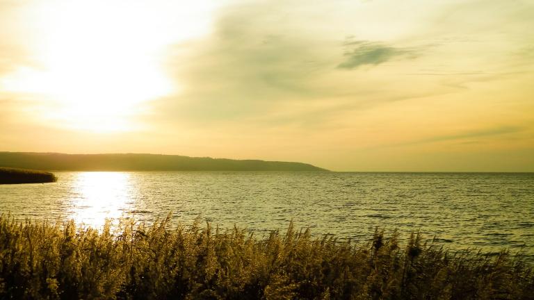 Beautiful view of sunrise over Vistula Lagoon. Coast close Frombork City shutterstock_1772214458.jpg